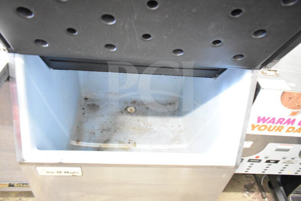 Ice-O-Matic ICE0400HWI commercial ice machine head on B40PSA bin, 115V, 1 phase, visible wear inside bin.