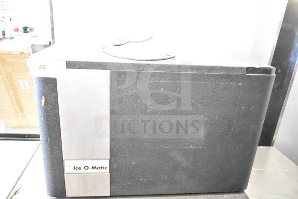 Ice-O-Matic ICE0400HWI commercial ice machine on B40PSA bin, 115V, 1 phase. Visible wear on sides, nameplate intact.