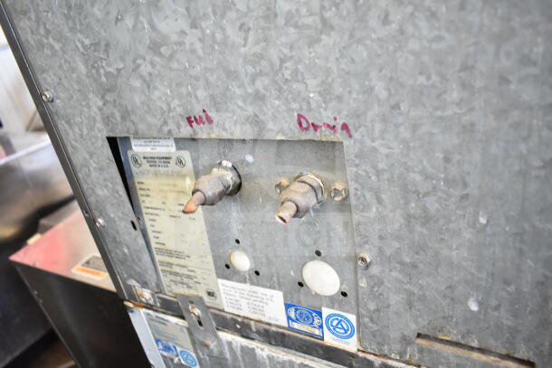 Ice-O-Matic ICE0400HWI ice machine head on B40PSA bin, 115V, 1 Phase. Labels indicating fill and drain connections.