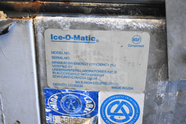 Ice-O-Matic ICE0400HWI commercial ice machine head on B40PSA bin, 115V. Label shows model, serial number, and energy efficiency.