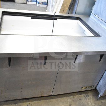 True TSSU-48-18M-B commercial prep table, missing lid, 115 volts, 1 phase, visible wear, labeling at the base.