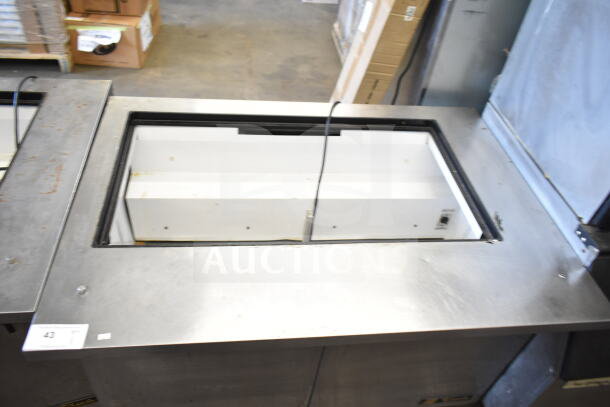 True TSSU-48-18M-B commercial prep table, stainless steel, missing lid, 115 volts, 1 phase, visible interior compartment.