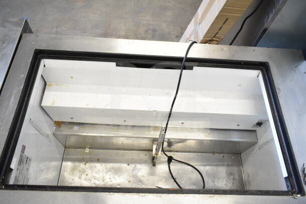 True TSSU-48-18M-B Commercial Prep Table, missing lid, stainless steel, 115 volts, 1 phase, interior view showing condition.