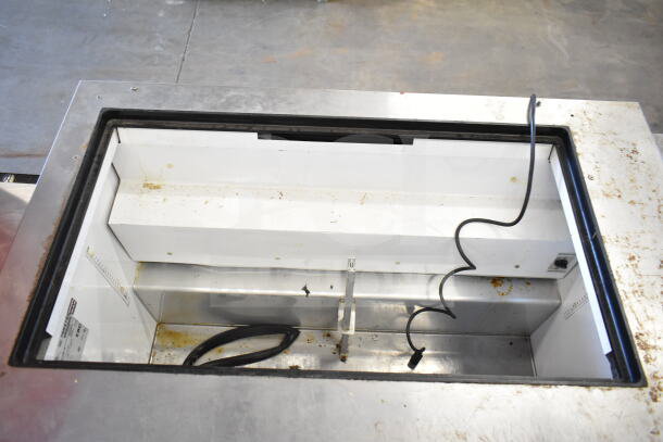 True TSSU-48-18M-B commercial prep table, missing lid, showing interior. 115 volts, 1 phase. Visible wear and cords.