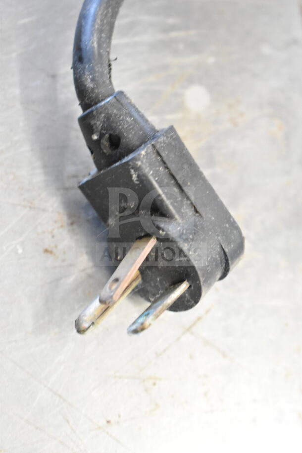 Close-up of a worn electric plug for the True TSSU-48-18M-B commercial prep table. No visible damage to prongs.