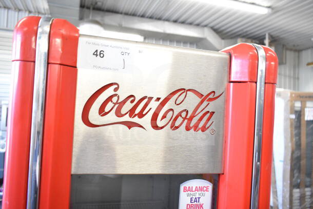 Imbera VR09 commercial single door cooler merchandiser, red with Coca-Cola branding, 115 volts, 1 phase, auction tag visible.