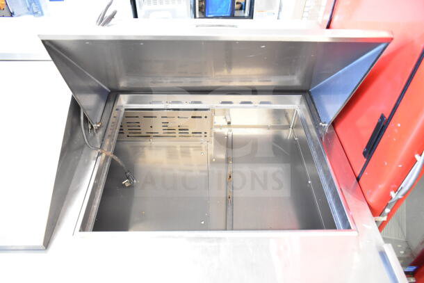 Turbo Air TST-72SD-30-N commercial prep table, stainless steel interior, spacious design, 115V, excellent condition.