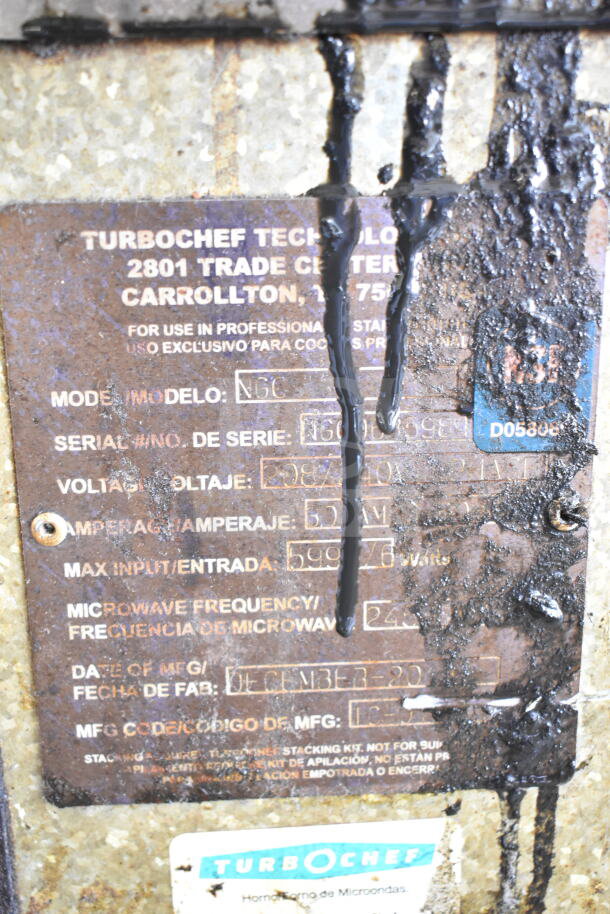 Turbochef NGC oven label showing model, serial number, and voltage details. Markings indicate 208/240 volts, 1 phase.
