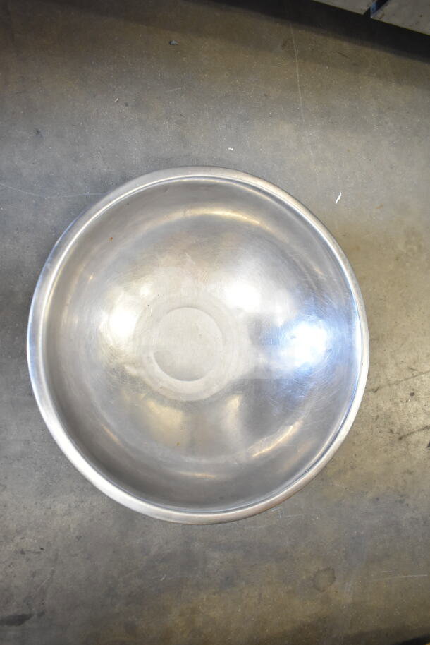 Stainless steel bowl with a polished finish, part of a lot including ladles and a poly drop-in bin. Multiply bid by 57.