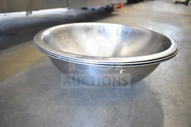Stainless steel bowl from a lot of 57 items, slight wear visible, includes ladles and poly drop-in bin.