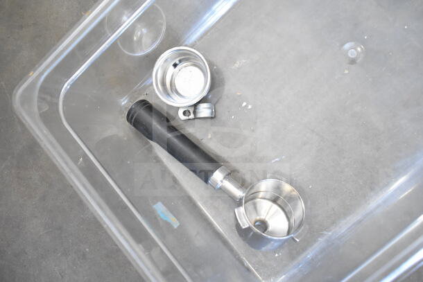 Clear poly bin containing various kitchen items including metal ladles and small stainless steel bowls; part of a 57-item lot.
