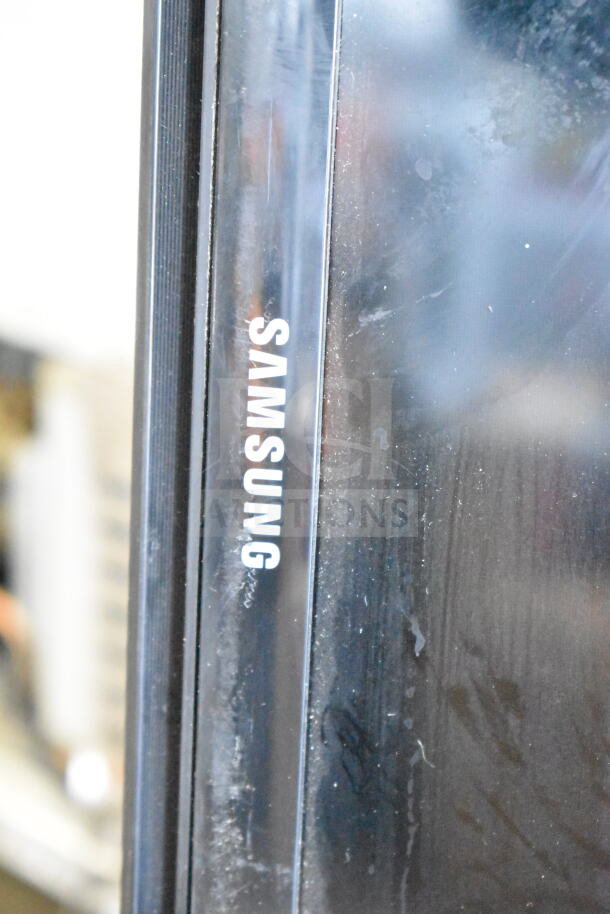Samsung UN50EH5300F TV close-up, showing logo on bezel. Displays signs of wear. Pickup required, no shipping.