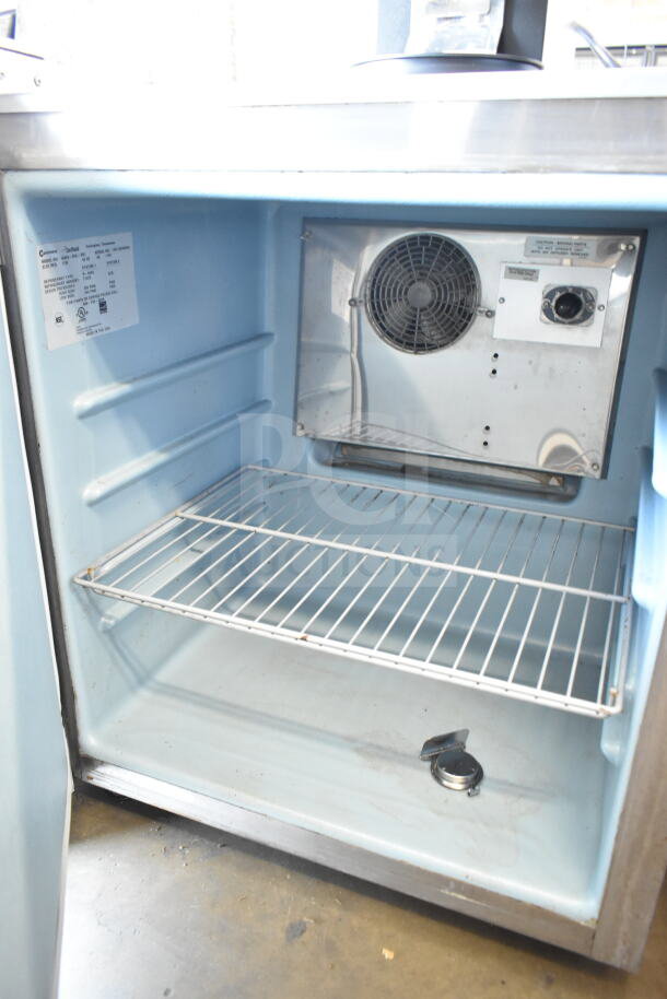 Delfield 406CA-DHL-DD1 commercial undercounter cooler, single door, 115 volts, 1 phase, clean interior, visible vent and shelf.