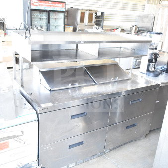 Delfield commercial sandwich salad prep table with four drawers, overhead shelf, and Bain Marie mega top. 115 volts, 1 phase.