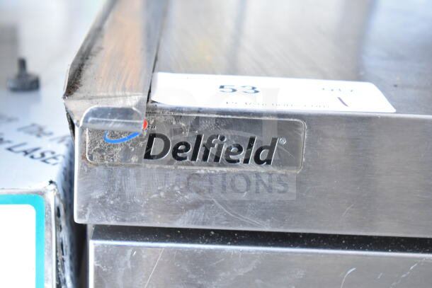 Delfield Commercial Prep Table, 4 drawers, over shelf, 115V, 1 phase, stainless steel, visible brand logo.