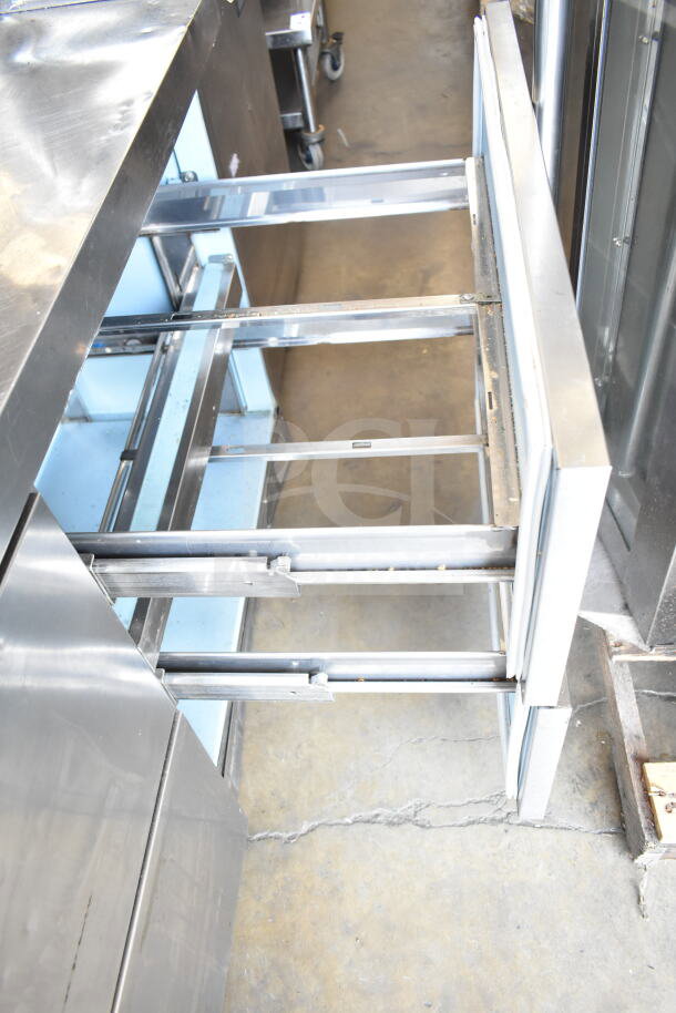 Delfield commercial sandwich salad prep table, bain marie mega top, 4 drawers, over shelf, 115V, 1 phase, open drawer view.