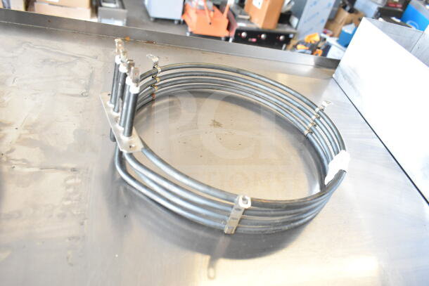 Metal circular heater element with connectors, identified as HPM236108K Moffat M236108K Element Assy, for auction.