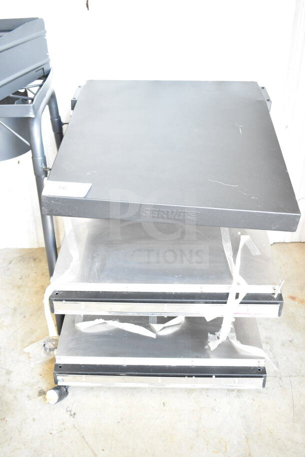 ServIt 423OAM65D 24" slanted 2-shelf countertop heated display merchandiser. Visible wear, tags intact. 120 volts, 1 phase.