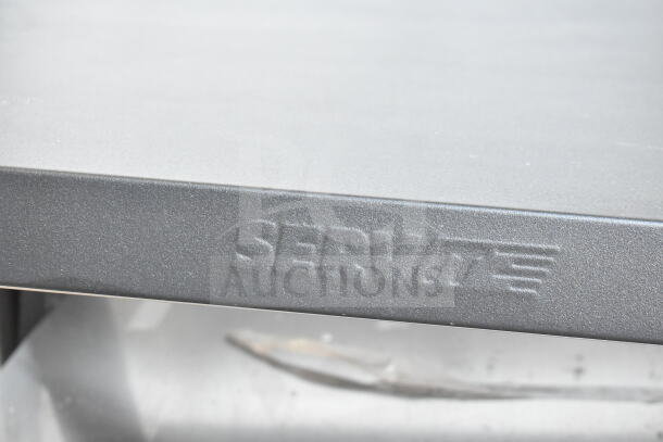 ServIt 423OAM65D display merchandiser close-up, showcasing the ServIt logo on the unit's metal surface.