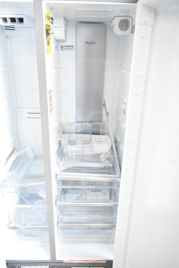 Brand new Whirlpool WRSC6536RZ00 reach-in cooler and freezer, 115 volts, 1 phase. Interior view with shelves and labels visible.