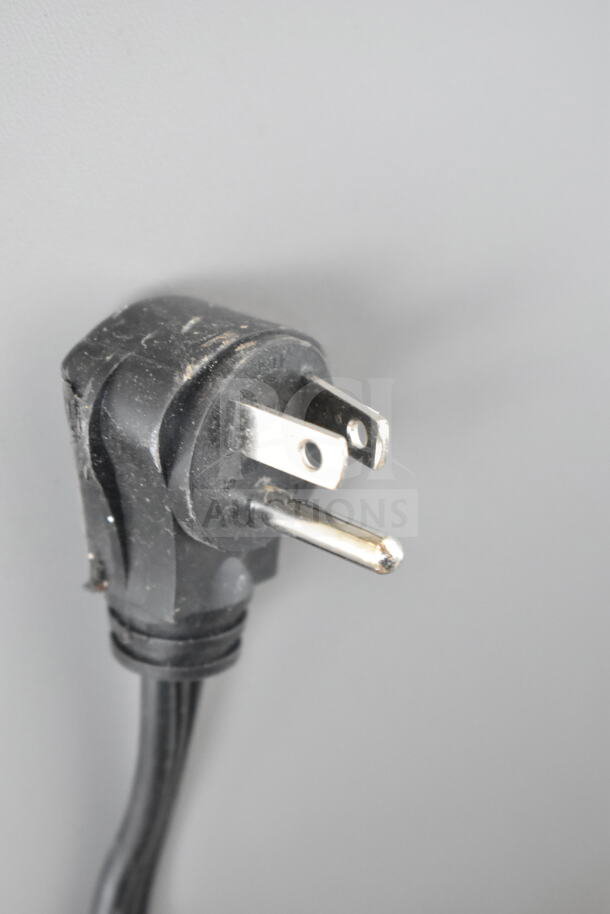 Power plug for Whirlpool WRSC6536RZ00 Reach In Cooler and Freezer, 115 Volts, 1 Phase, showing slight wear.