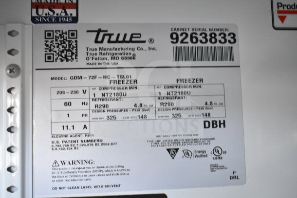 Label on True GDM-72F-HC commercial freezer; shows specifications, refrigerant type R290, voltage 208-230, and model details.