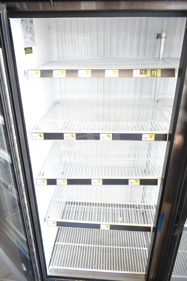 2017 True GDM-72F-HC commercial 3-door freezer, 115/208-230V, 1 phase, white interior, empty wire shelves, clear door.