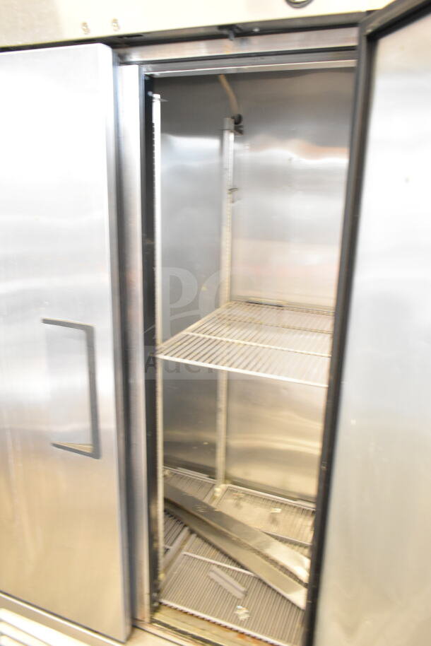 2017 True T-35 Commercial 2 Door Reach-In Cooler, stainless steel, 115V, 1 phase, interior shelving visible, open doors.