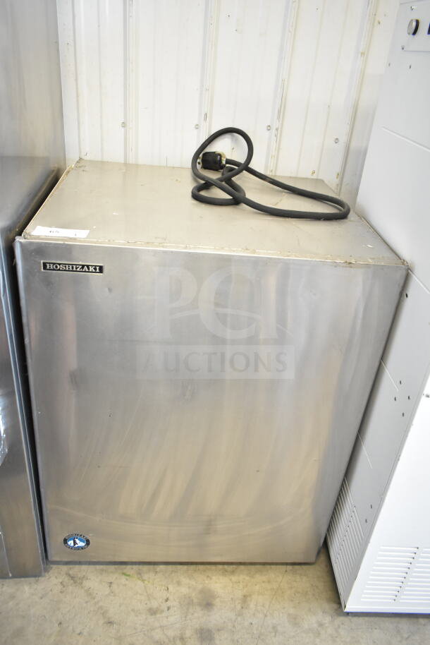 Hoshizaki KM-900MRH commercial ice machine head, stainless steel, 208-230V, 1 phase, visible logo and cord, good condition.