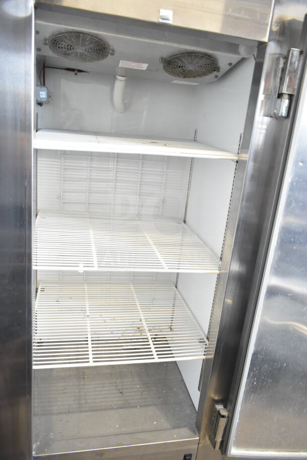 Leader FR30 S/C commercial single door reach-in cooler, 115V, 1 Phase, features metal shelving, visible cooling fans; used condition.