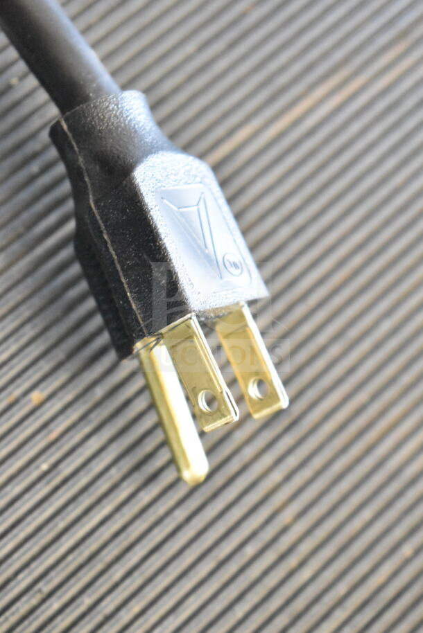 Hilliard's Commercial Floor Style Chocolate System power plug, 120 Volts, 1 Phase, black cord, on a textured surface.
