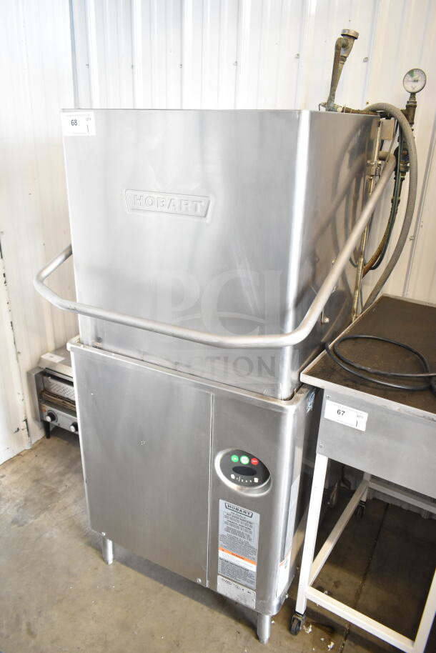 Hobart AM15 commercial dishwasher, stainless steel, corner pass through, 208-240V, 3 phase, visible control panel.