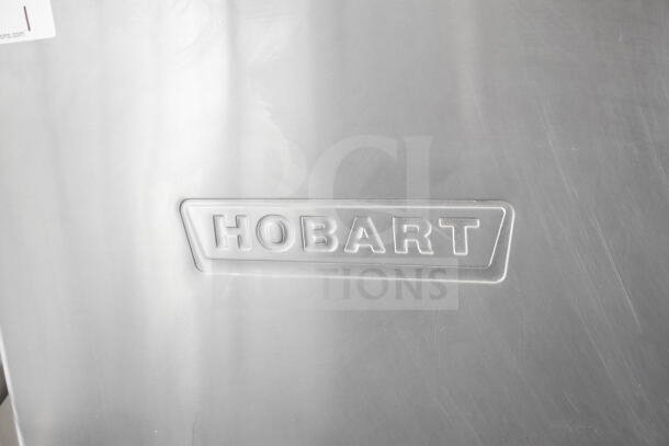 Hobart AM15 Commercial Corner Pass Through Dishwasher. Stainless steel, 208-240V, 3-phase. Hobart logo embossed on door.