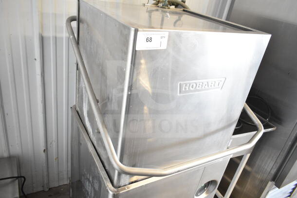Hobart AM15 commercial dishwasher, corner pass-through style, stainless steel, 208-240V, 3 phase, serial number visible.