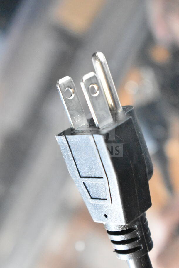 Close-up of a power plug compatible with KoolMore CDA-13C commercial merchandiser, suitable for 110-120 volts.