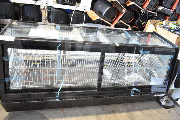Avantco 360BCSS60HCB 60" black self-serve refrigerated bakery display case with LED lighting; broken glass visible.