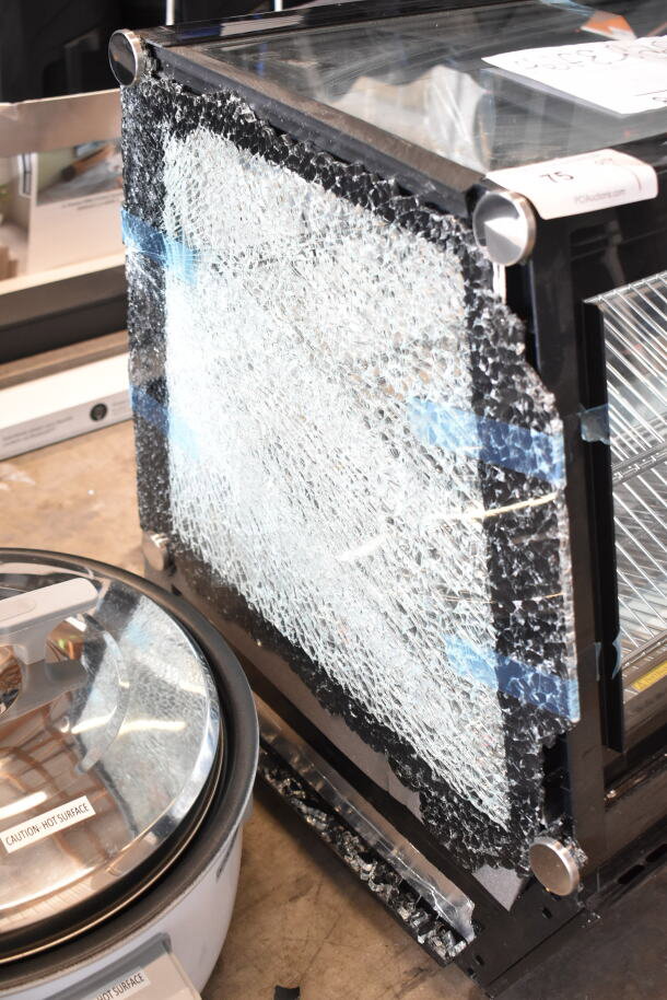 Avantco 360BCSS60HCB black refrigerated bakery display case, 60", with broken glass, LED lighting, self-serve model.