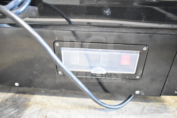 Avantco Model 360BCSS60HCB black refrigerated display case control panel; shows settings and power switch. Visible wiring.