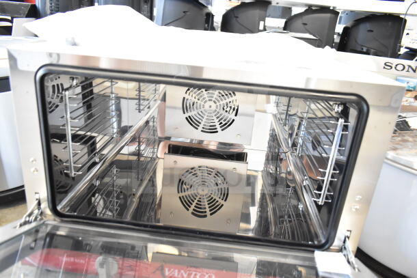 Brand new Avantco 177CO16 half-size countertop convection oven, 1.5 Cu. Ft., interior view, minor scratches.