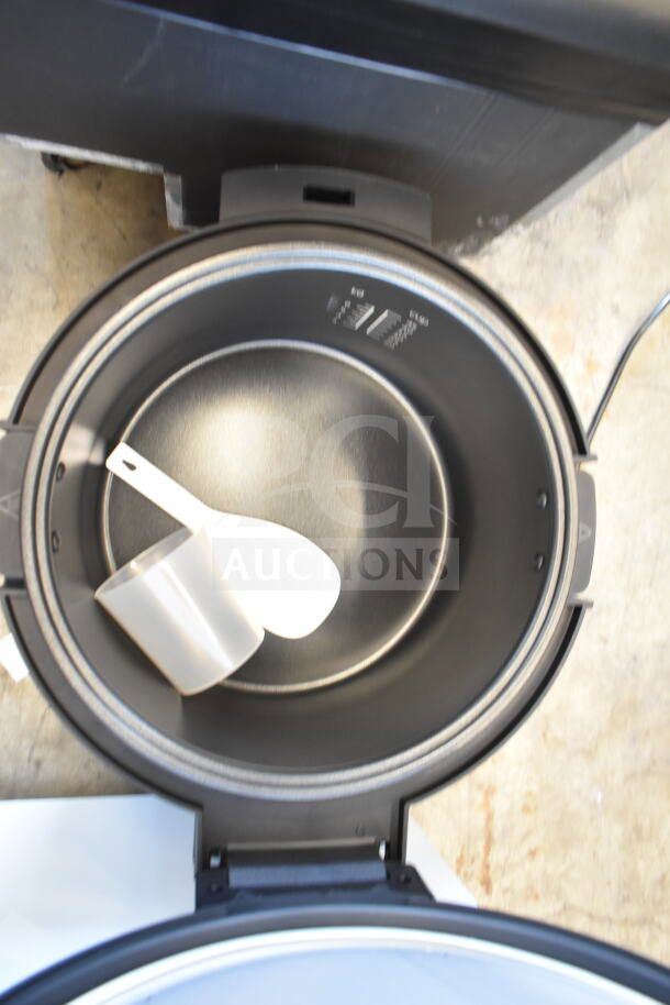 Brand new Avantco 177RCSB90 digital electric rice cooker for 90 cups, with hinged lid, scooper, and measuring cup.