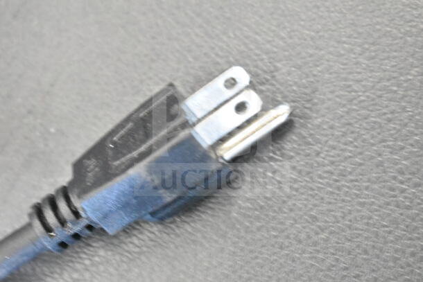 Close-up of a power plug for the Avantco 177DHC26 hot beverage dispenser, 120 volts, highlighting the prongs.