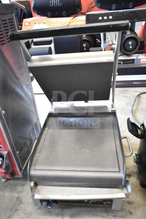 Star Commercial Panini Press, countertop model. Uses 115 volts, 1 phase. Visible wear on cooking surface, otherwise good condition.