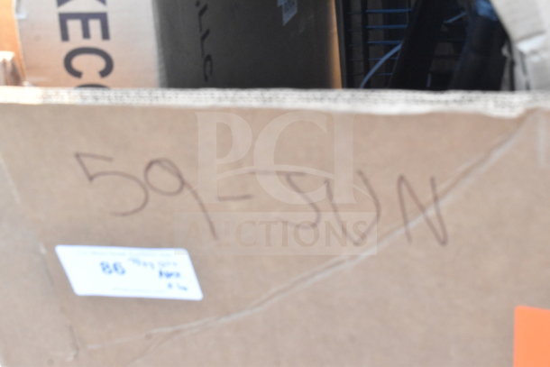 Cardboard box marked "59-JUN" containing scratch and dent items like whiteboard, ice bin, and pan rack. Condition: Brand new.