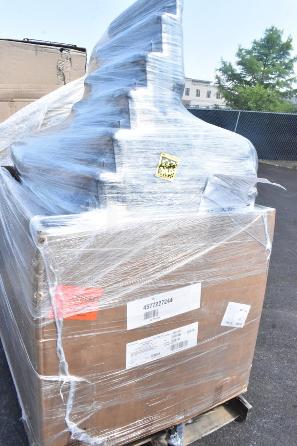 Pallet of 24 brand new Lancaster Table & Seating 21" Silver Vein Church Chairs wrapped in plastic, labels visible.