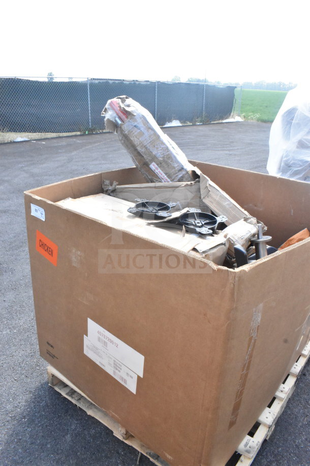 Large box containing 16 brand new scratch and dent items, including table leg pieces. Labels indicate batch details.