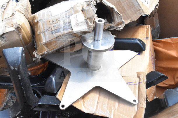 16 brand new scratch and dent items, including metal table leg pieces, in original packaging with visible wear.