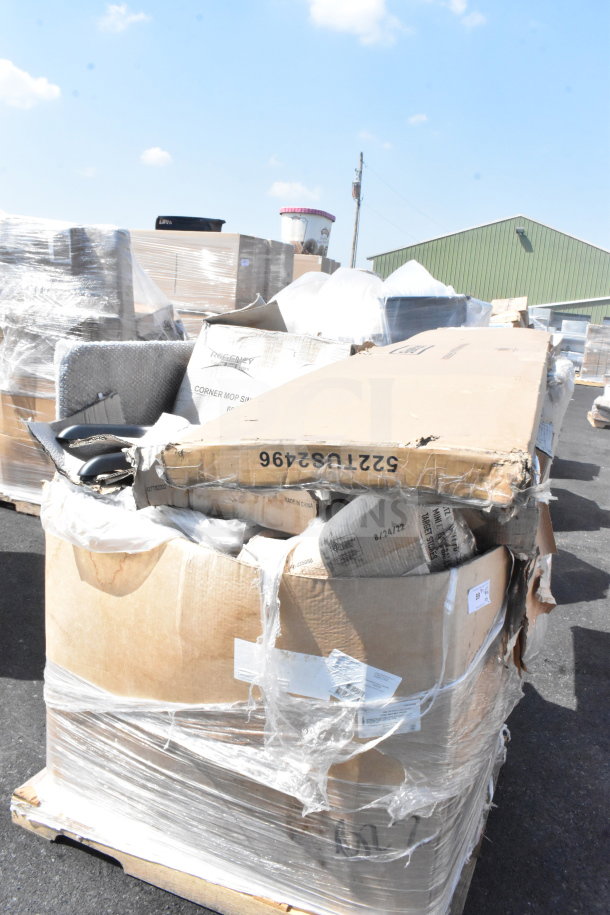 Cardboard boxes on pallet containing mop sink and mop heads, some boxes are dented. Labels show "Corner Mop Sink" and date "8/21/22."