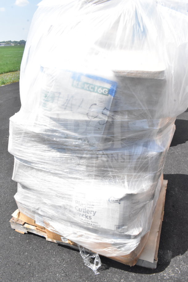 A pallet wrapped in plastic containing 28 scratch and dent items including barrel sack, cups, plates, and a bakery box.