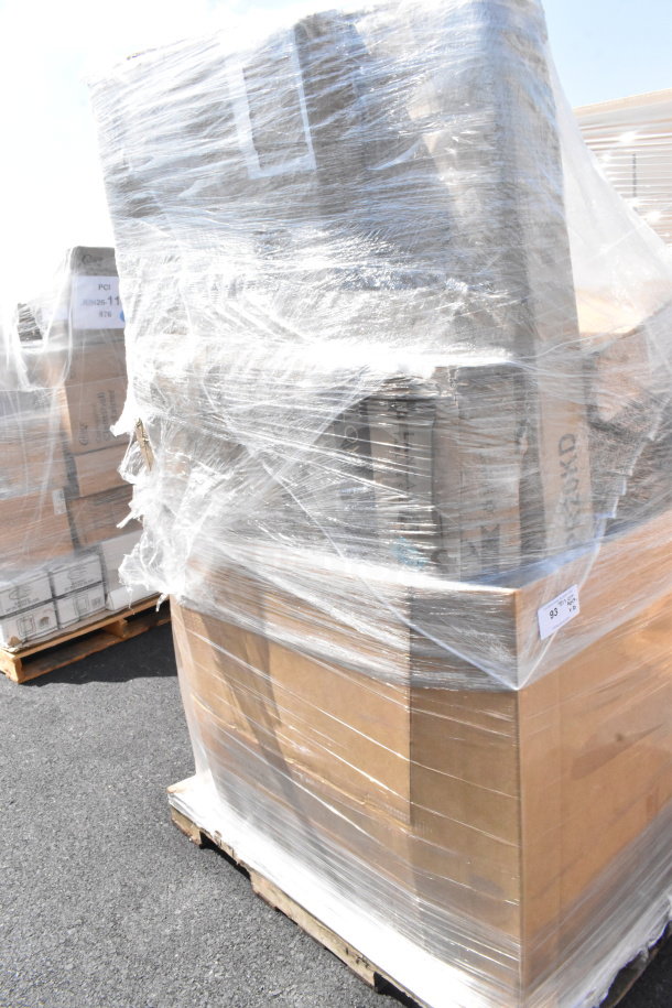 Shrink-wrapped pallet of assorted scratch and dent items including tongs, Moscow Mule mugs, and a sink. Visible labels read "JUN-2" and "876."