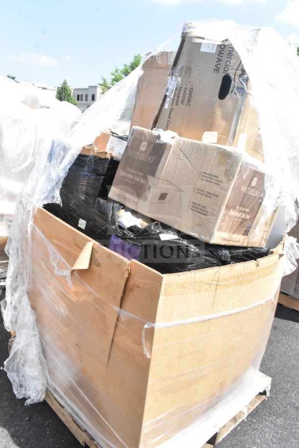 Large pallet with assorted items in boxes including tongs, Moscow Mule mugs, and a sink, labeled with Waterloo brand, wrapped in plastic.